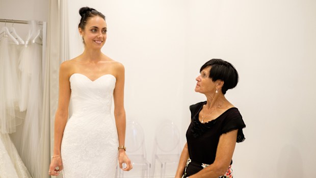 The sweetheart neckline suits this bride.