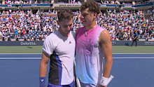 Thiem and Shelton embrace at the net.