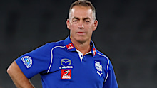 MELBOURNE, AUSTRALIA - MARCH 23: Alastair Clarkson Senior Coach of the Kangaroos warms up ahead of the round two AFL match between North Melbourne Kangaroos and Melbourne Demons at Marvel Stadium, on March 23, 2025, in Melbourne, Australia. (Photo by Morgan Hancock/Getty Images)