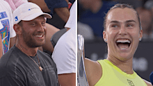Aryna Sabalenka laughs while speaking to the crowd.