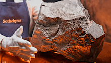 A Martian meteorite, weighing 54.388 lbs. (24.67 kg), said to be the largest piece of Mars on Earth, estimated at $2 - 4 million, is displayed at Sotheby's, in New York, Wednesday, July 9, 2025, part of their Geek Week auction, July 16, 2025. (AP Photo/Richard Drew)