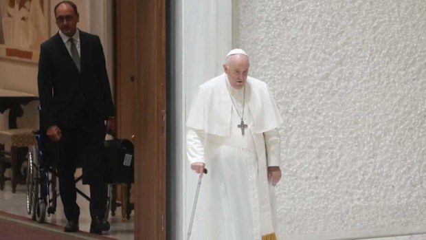 Massimiliano Strappetti watches Pope Francis walking during a general audience in August 2022.