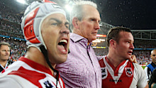 Wayne Bennett celebrates with Jamie Soward and Dean Young after the Dragons' 2010 NRL Premiership. (Getty)