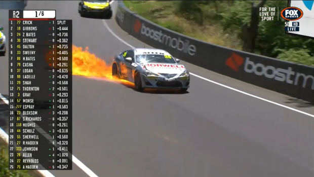 Kai Allen's car spews fire after a multi-car crash in Race 2 of the TGRA86 category.