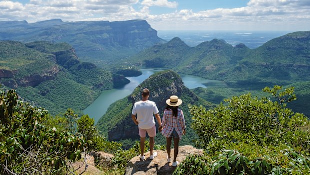 Panorama Route South Africa, Blyde river canyon with the three rondavels, view of three rondavels and the Blyde river canyon in South Africa. Asian women and Caucasian men on vacation in South Africa
