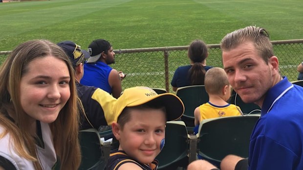 Ash and Jarrod with their younger brother, Lucas (centre).
