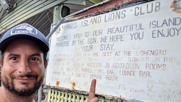 Dan Ilic at the Manus Island welcome sign.