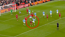 Jeremy Doku challenges Alexis Mac Allister in the box during Manchester City's meeting with Liverpool.