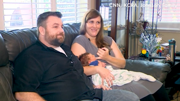 Emily and Michael Johnson speak of how their planned hospital birth turned into a home birth - with Emily delivering on their front lawn.