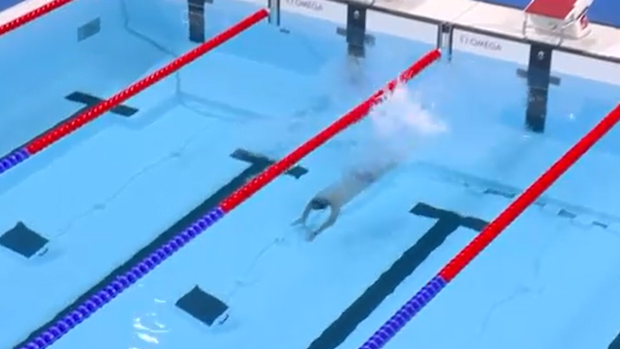 The man didn't hesitate to dive in to retrieve the cap.