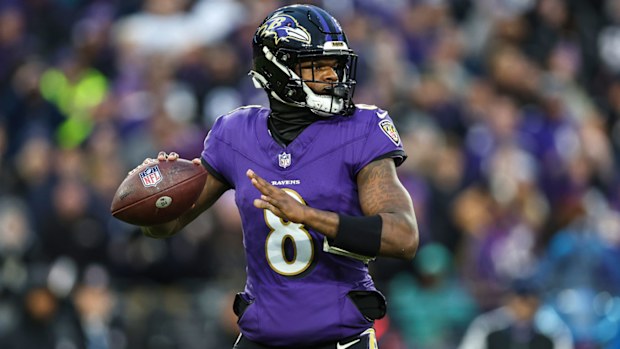 Lamar Jackson prepares to throw a pass for the Baltimore Ravens.