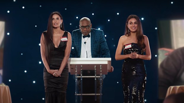 Demi Moore (left) and Mila Kunis (right) in the AT&T Super Bowl commercial