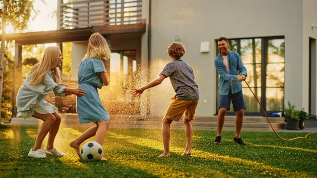 Happy family playing in the garden.