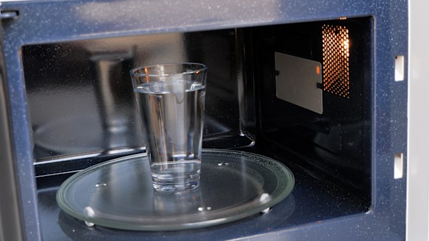 Inside View of a glass of water heating in the microwaveInside View of a glass of water heating in the microwave