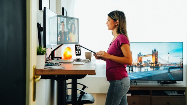 Woman working from home at standing desk