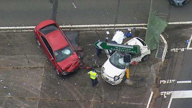 Two people have been killed and a driver has been arrested after a two-car crash in Sydney's south-west.
