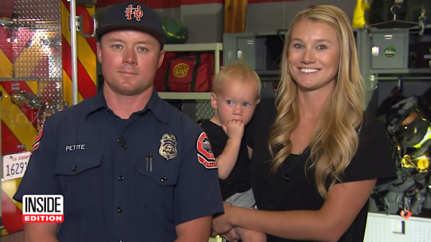 Firefighter Zachary Petite with his wife and youngest son who he rescued from drowning 