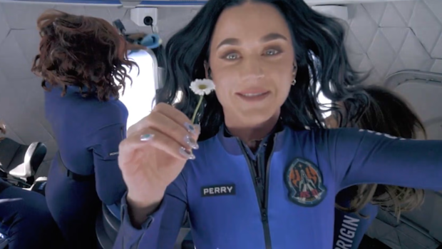 Katy Perry holds up a daisy during her flight to space with Blue Origin, April 2025