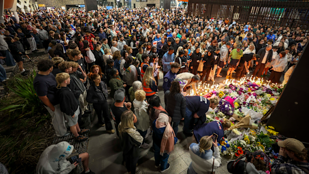 Strangers have left dozens of flowers, candles and messages for the security guard.