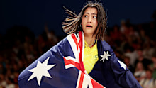 Australian BMX star Saya Sakakibara celebrates with the Australian flag after winning Paris gold.