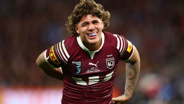 Maroons fullback Reece Walsh clutches at his back during the State of Origin decider.
