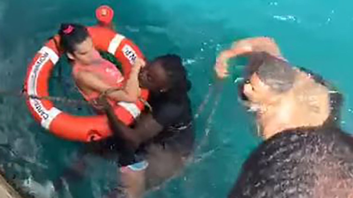 Two men labelled heroes after saving woman in wheelchair from drowning ...