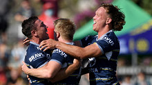 The Cowboys celebrate a try in the Dragons clash.