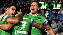 Raiders players, including Joseph Tapine (right), celebrate a try against the Warriors in round 12, 2025.