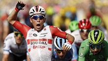 Caleb Ewan reacts to winning the final stage of the Tour de France in Paris.