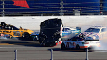 Harrison Burton flips after an on-track incident with Denny Hamlin during the NASCAR Cup Series 64th Annual Daytona 500 at Daytona International Speedway.
