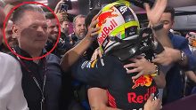 Max Verstappen's father, Jos, watches as Red Bull team members congratulate race winner Sergio Perez after the Saudi Arabian Grand Prix.