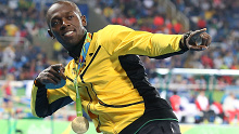 Usain Bolt with his 100m gold medal at the Rio 2016 Olympic Games.