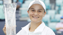 Ashleigh Barty poses with the winner's trophy after defeating Bianca Andreescu in the Miami Open final.