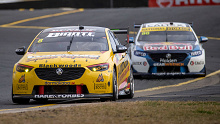 Nick Percat leads Jamie Whincup at Sydney Motorsport Park.