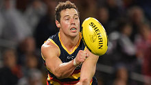 Tom Doedee of the Crows handballs during the round four AFL match between the Adelaide Crows and the Collingwood Magpies at Adelaide Oval on April 13, 2018 in Adelaide, Australia.
