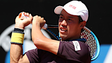 Kei Nishikori of Japan returns a backhand at the Rome Masters.