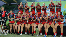 The Dragons celebrate after winning the final 