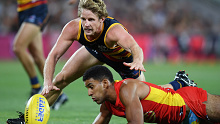 Adelaide Crows captain Rory Sloane attacks the footy.