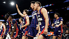 Adelaide 36ers players celebrate another basket during the win over the Phoenix Suns