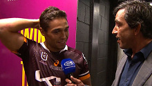 Te Maire Martin chats with his old captain Johnathan Thurston following his comeback match