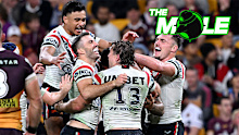 Sydney Roosters players celebrate against the Broncos.
