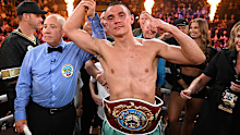 Tim Tszyu celebrates with the WBO super-welterweight title belt after beating Brian Mendoza