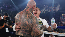 Paul Gallen embraces Lucas Browne after winning their fight by TKO.