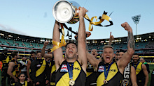 Richmond captain Trent Cotchin holds the premiership trophy aloft after last year's AFL Grand Final.