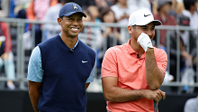 Day shares a light-hearted moment on the course with Woods during the play