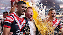 Roosters coach Trent Robinson cops the obligatory shower after another grand final win.