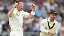 Peter Siddle and Phillip Hughes celebrate a wicket during an Ashes Test.