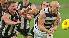 Gary Ablett of the Cats looks to pass the ball 