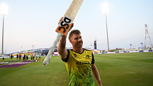 David Warner of Australia celebrates following the ICC Men's T20 World Cup match between Australia and Windies at Sheikh Zayed stadium on November 06, 2021 in Abu Dhabi, United Arab Emirates. (Photo by Gareth Copley-ICC/ICC via Getty Images)