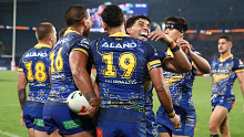 Parramatta Eels players celebrate a try against the Rabbitohs in round 12.
